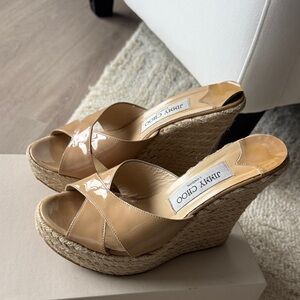 Jimmy Choo Nude Patent Wedge Sandals
Great to dress up any outfit!